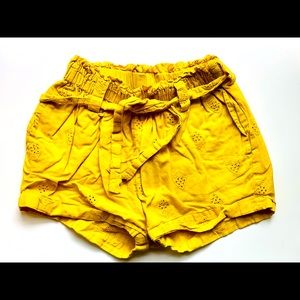 Mini Boden paper bag shorts in yellow.